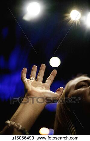 Stock Image - Woman praising God. Fotosearch
