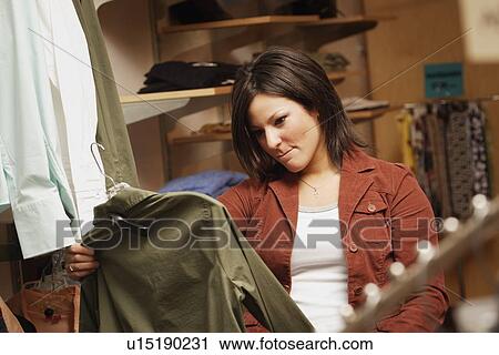 Woman shopping for clothes View Large Photo Image Stock Image - Woman shopping for clothes. Fotosearch