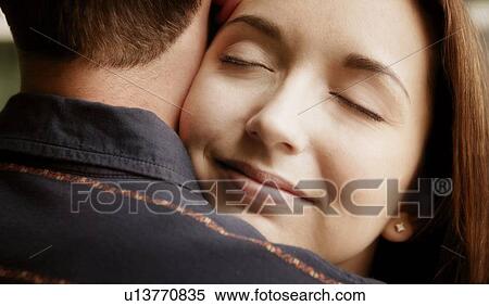 Stock Photography - A couple embrace. Fotosearch
