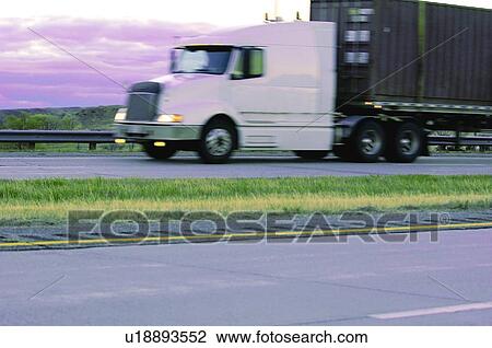 A semi truck on a highway View Large Photo Image Stock Image - A semi truck on a highway. Fotosearch