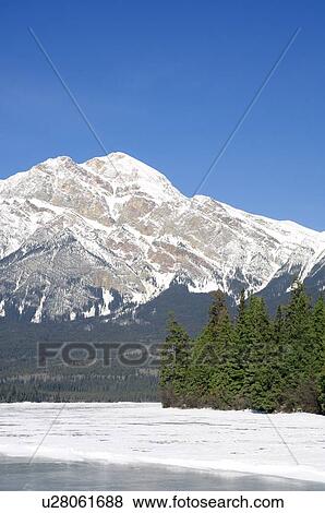 A winter mountain scene View Large Photo Image Stock Photo - A winter mountain scene. Fotosearch
