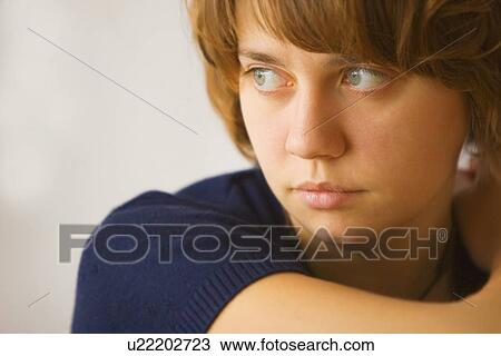 Stock Image - A young woman's face. Fotosearch