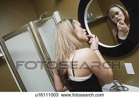 Applying lipstick View Large Photo Image Stock Image - Applying lipstick. Fotosearch