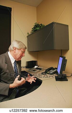 Stock Image - Businessman experiences frustration. Fotosearch