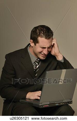Businessman with laptop computer View Large Photo Image Stock Image - Businessman with laptop computer. Fotosearch
