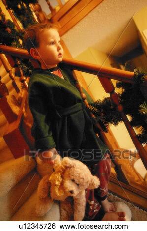 Child comes downstairs Christmas morning View Large Photo Image Stock Photograph - Child comes downstairs Christmas morning. Fotosearch