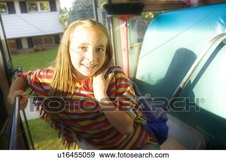 Child getting on school bus View Large Photo Image Stock Photo - Child getting on school bus. Fotosearch
