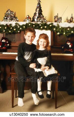 Stock Image - Children at Christmas. Fotosearch