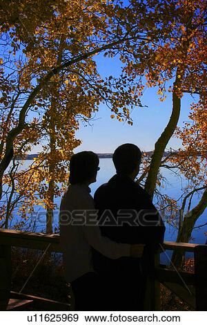 Stock Photo - Couple enjoy the view. Fotosearch