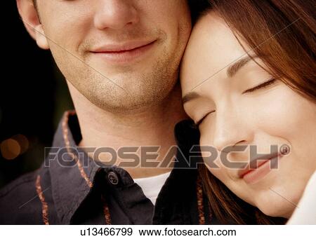 Stock Photo - Couple enjoying an embrace. Fotosearch