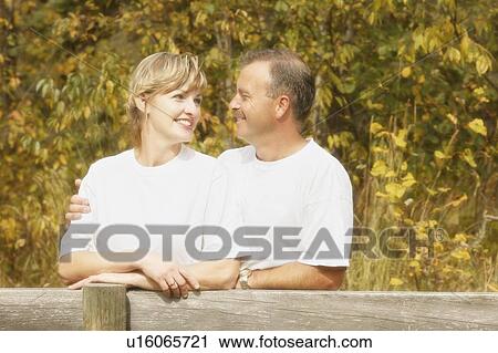 Couple gaze into each other's eyes View Large Photo Image Stock Image - Couple gaze into each other's eyes. Fotosearch