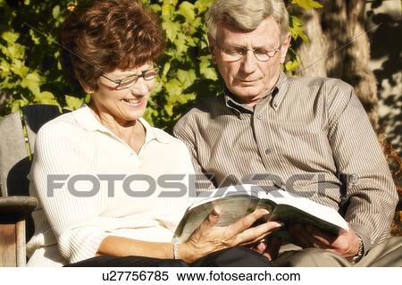 Couple read together View Large Photo Image Stock Photography - Couple read together. Fotosearch