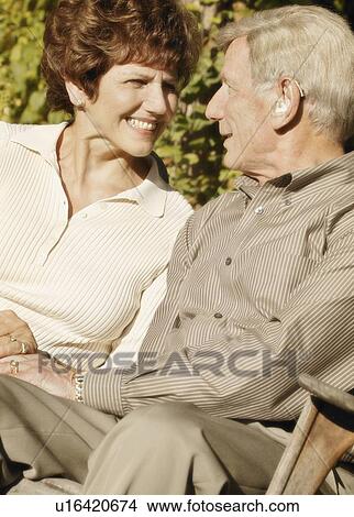 Picture - Couple sitting. Fotosearch