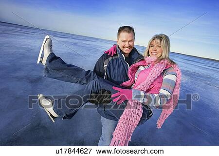 Couple skating View Large Photo Image Stock Photo - Couple skating. Fotosearch