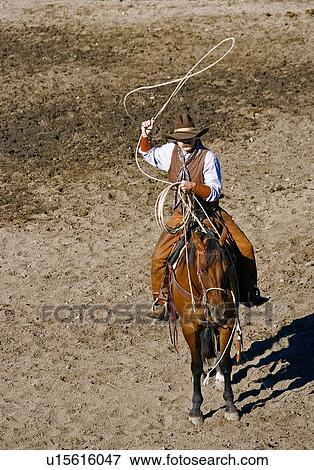 Stock Photo - Cowboy with lasso. Fotosearch