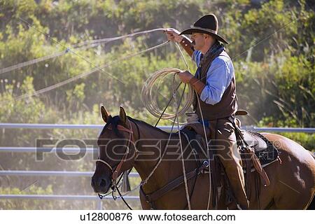 Stock Photograph - Cowboy with lasso. Fotosearch