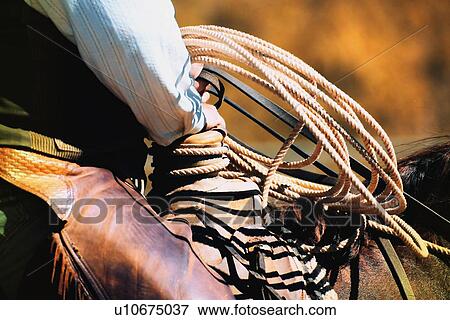 Stock Photo - Cowboy with rope. Fotosearch