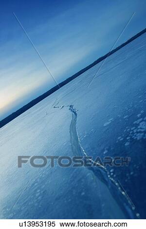 Frozen lake with crack View Large Photo Image Stock Photography - Frozen lake with crack. Fotosearch