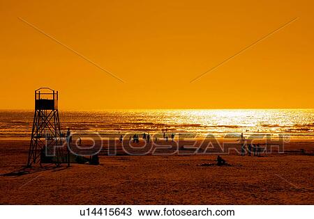 Stock Image - Fun on the beach. Fotosearch