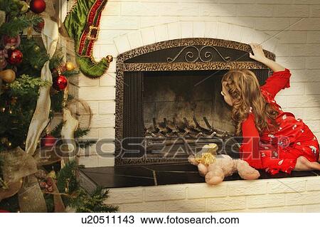 Girl checks for Santa View Large Photo Image Stock Image - Girl checks for Santa. Fotosearch