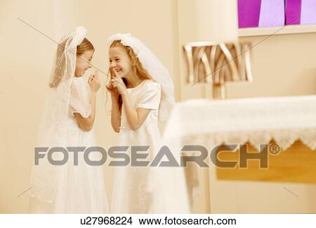 Picture - Girls taking their first communion. Fotosearch
