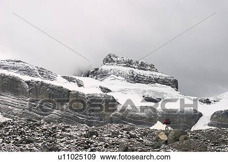 Stock Photo - Hiker on mountain. Fotosearch
