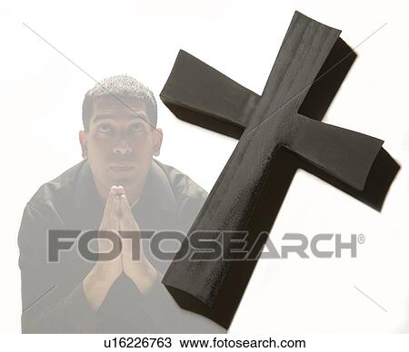 Stock Image - Man praying. Fotosearch