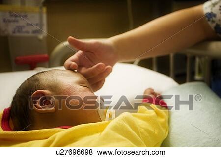 Stock Photo - Newborn in the hospital. Fotosearch