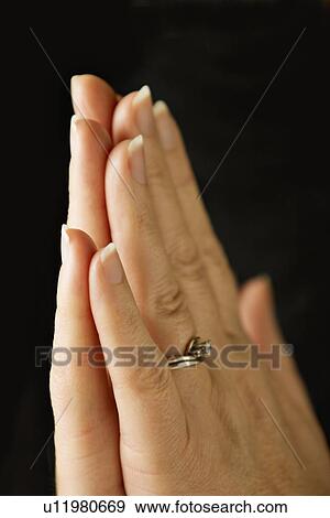Stock Photo - Praying hands. Fotosearch