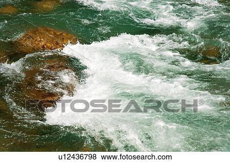 Rapids in river View Large Photo Image Stock Photo - Rapids in river. Fotosearch