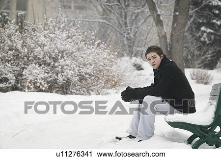 Sitting on a snowy bench View Large Photo Image Stock Image - Sitting on a snowy bench. Fotosearch