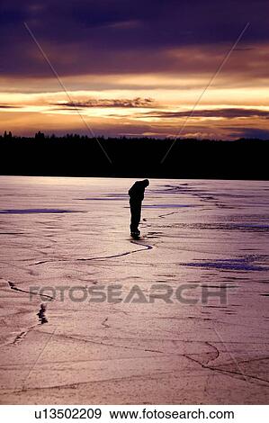 Skating on a frozen lake View Large Photo Image Stock Photo - Skating on a frozen lake. Fotosearch