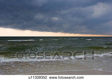 Storm clouds over the surf View Large Photo Image Stock Image - Storm clouds over the surf. Fotosearch