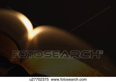 Sunray on open book View Large Photo Image Stock Photography - Sunray on open book. Fotosearch