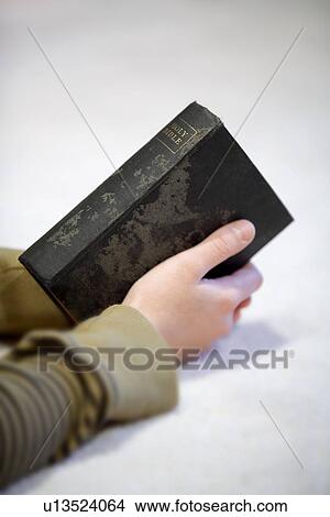 Teen holding Bible View Large Photo Image Picture - Teen holding Bible. Fotosearch