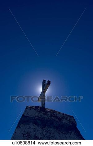 The cross and a light View Large Photo Image Picture - The cross and a light. Fotosearch