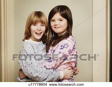 Picture - Two children hugging. Fotosearch