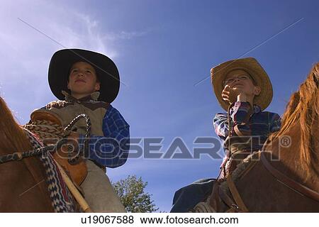 Two young cowboys View Large Photo Image Stock Photo - Two young cowboys. Fotosearch