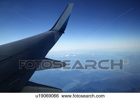 Wing of a plane View Large Photo Image Stock Photograph - Wing of a plane. Fotosearch