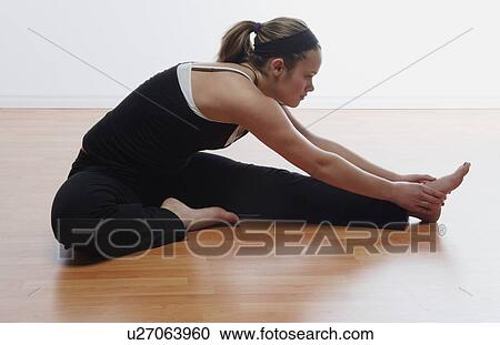 Woman doing stretches View Large Photo Image Stock Image - Woman doing stretches. Fotosearch
