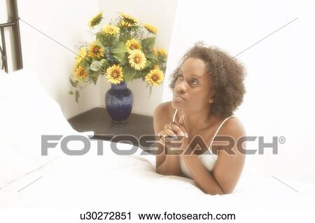 Woman prays by her bedside View Large Photo Image Stock Image - Woman prays by her bedside. Fotosearch
