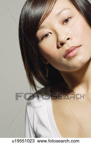 Stock Image - Woman with serious expression. Fotosearch