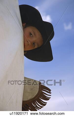 Stock Image - Young cowboy. Fotosearch