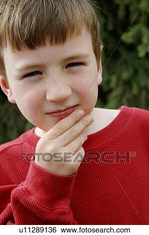Stock Photograph - A child contemplating life. Fotosearch