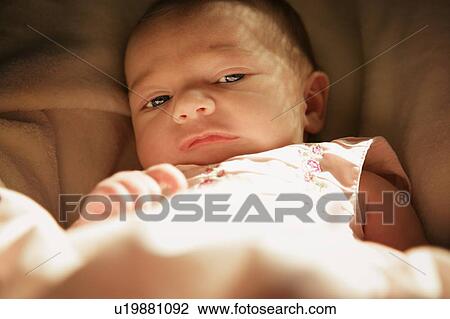 Baby lying down View Large Photo Image Stock Image - Baby lying down. Fotosearch