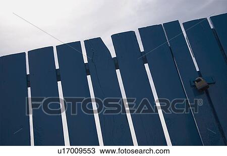 Stock Image - Blue wooden fence. Fotosearch