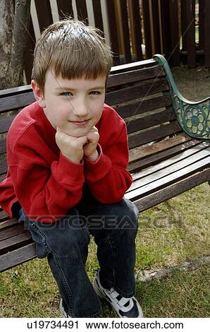 Boy on bench View Large Photo Image Stock Image - Boy on bench. Fotosearch