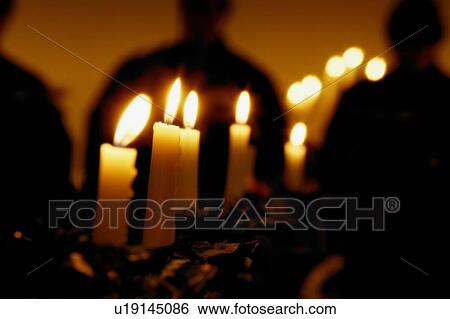 Stock Photograph - Candles in a row. Fotosearch
