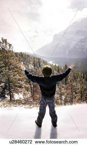 Stock Image - Child with hands raised. Fotosearch