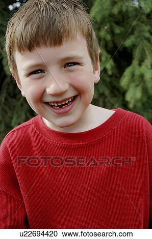 Stock Image - Grinning boy. Fotosearch